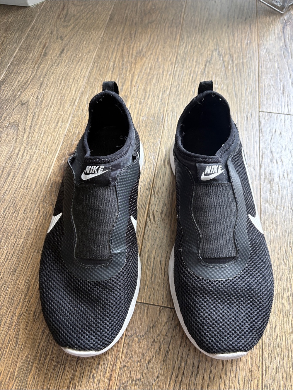 Nike Men’s Black Slip-On Mesh Sneakers with White Swoosh